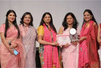 Dr. Shilpi Sharma Receiving a Certificate