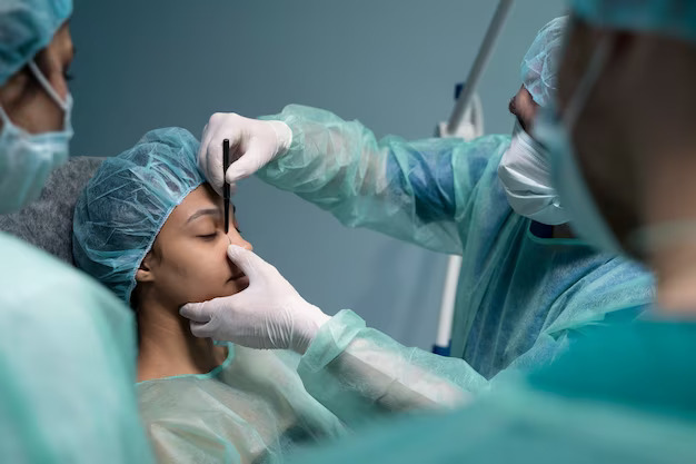 Surgeon performing a laser surgery procedure